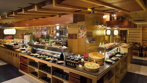 A buffet area with various food stations and a counter displaying dishes. - Grand Hyatt Taipei (Taipei)