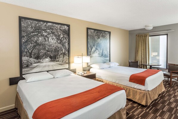 Premium bedding, laptop workspace, blackout drapes