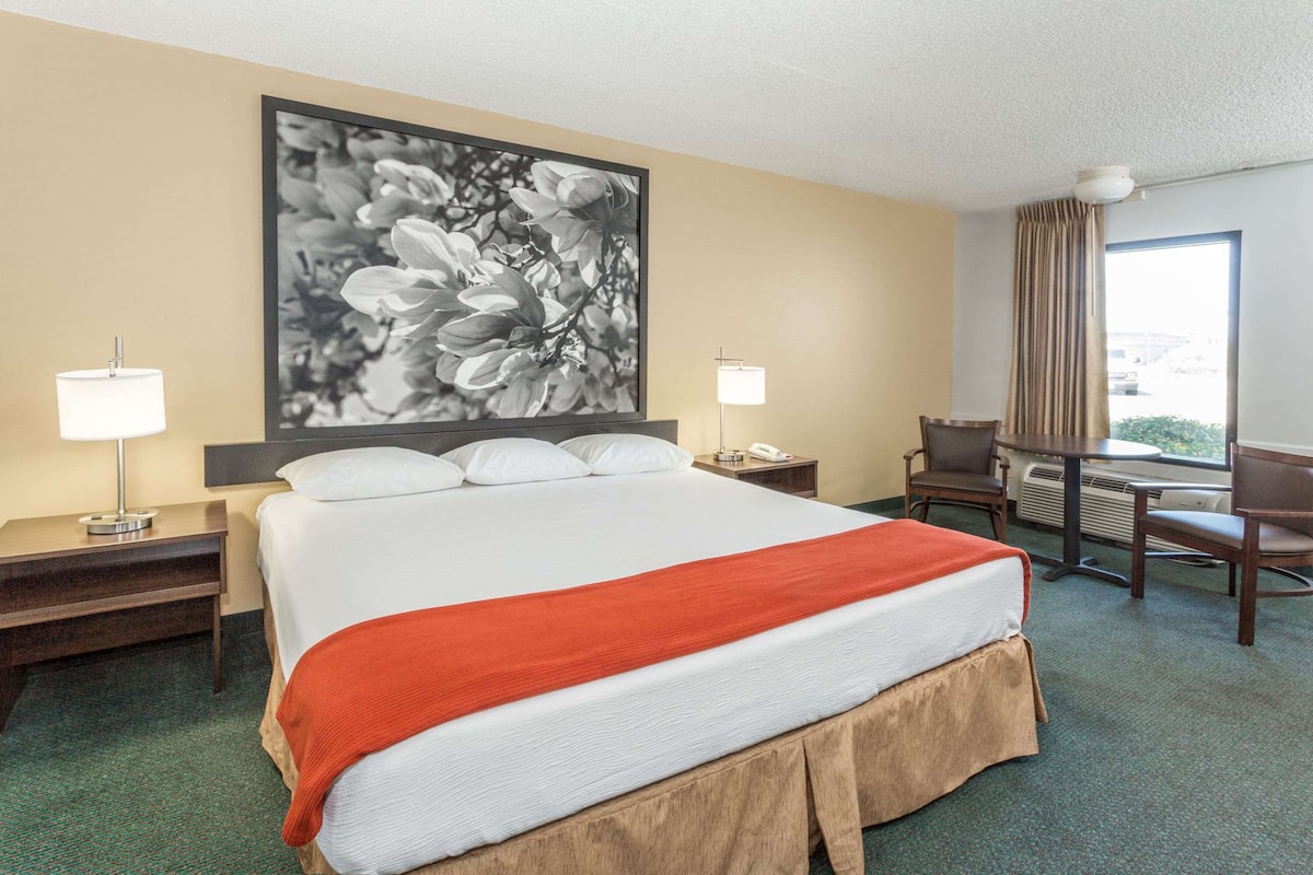 Premium bedding, laptop workspace, blackout curtains