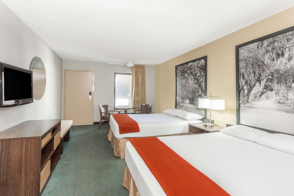 Premium bedding, laptop workspace, blackout curtains