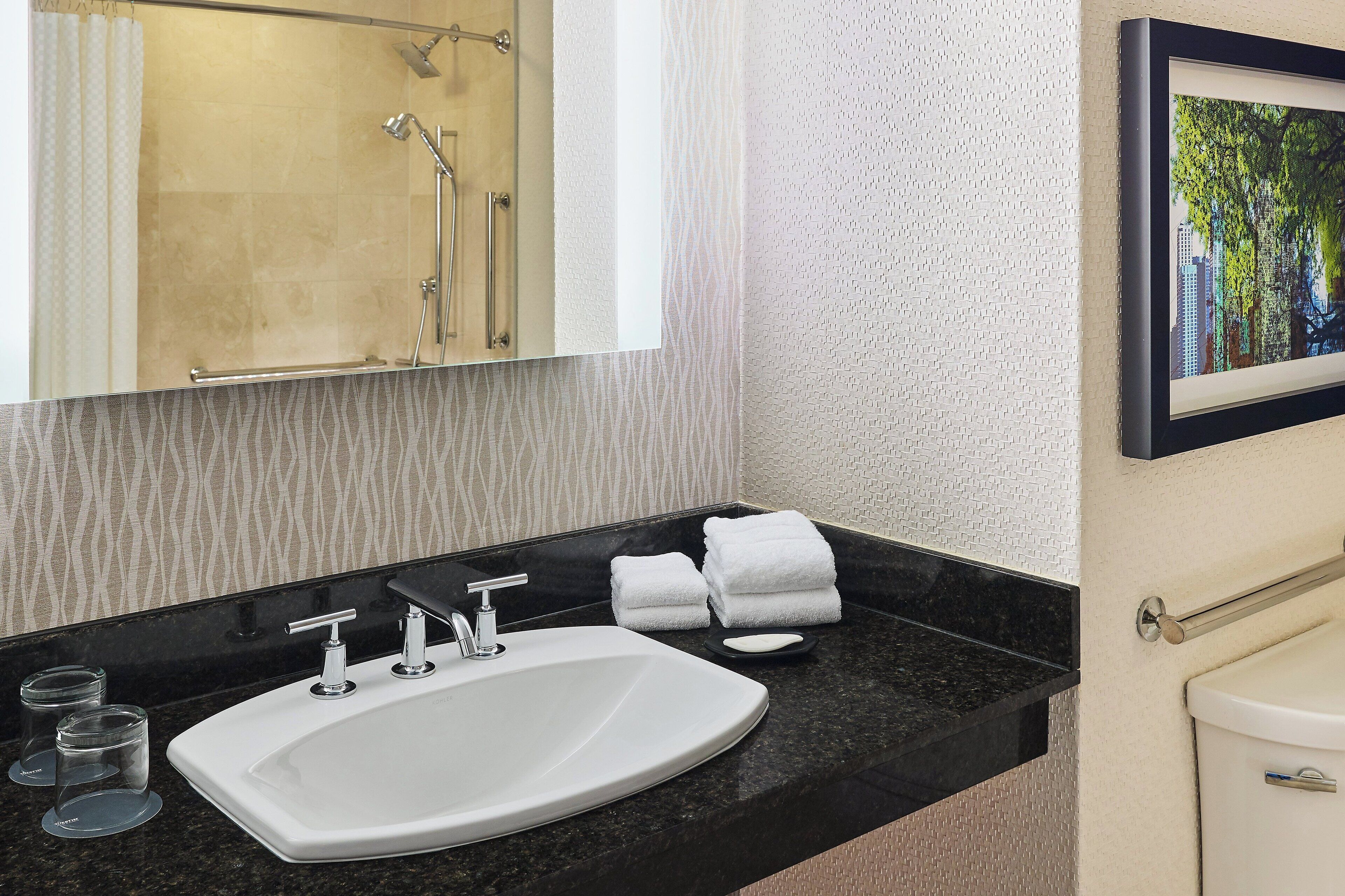 combined shower/bathtub, free toiletries, hair dryer, bathrobes