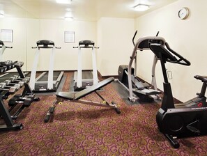 A gym with treadmills, elliptical machines, and dumbbells. - Holiday Inn Express Union City (San Jose) by IHG (Union City)