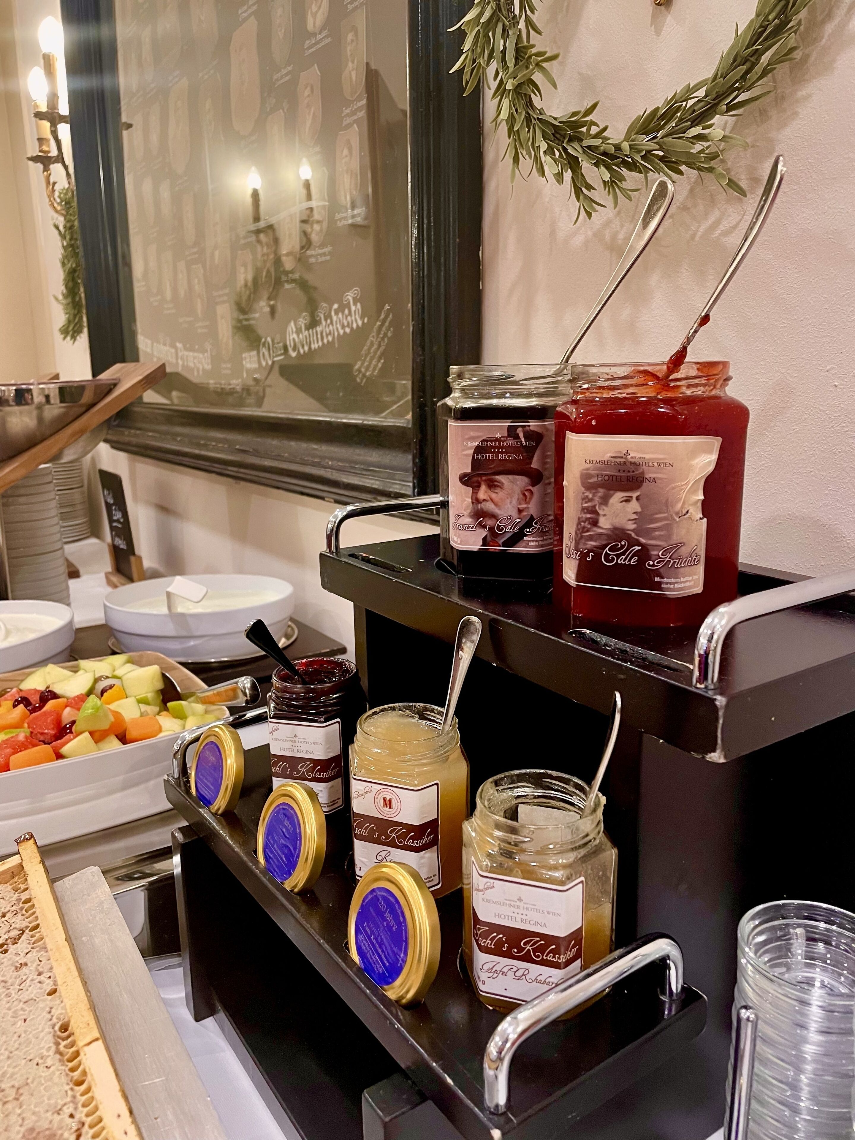 A buffet setup with various food items and condiments.