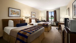 A hotel room with two beds, a desk, a television, and artwork on the walls. - Days Inn by Wyndham Oglesby/ Starved Rock (Oglesby)