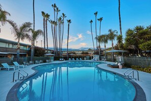 Outdoor pool, open 7:00 AM to 10:00 PM, pool umbrellas, sun loungers