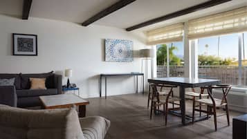 Suite, 1 Bedroom, Pool View | Living area | 55-inch flat-screen TV with cable channels, TV