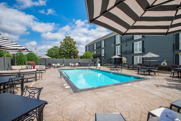 Seasonal outdoor pool, open 9:00 AM to 10:00 PM, pool umbrellas