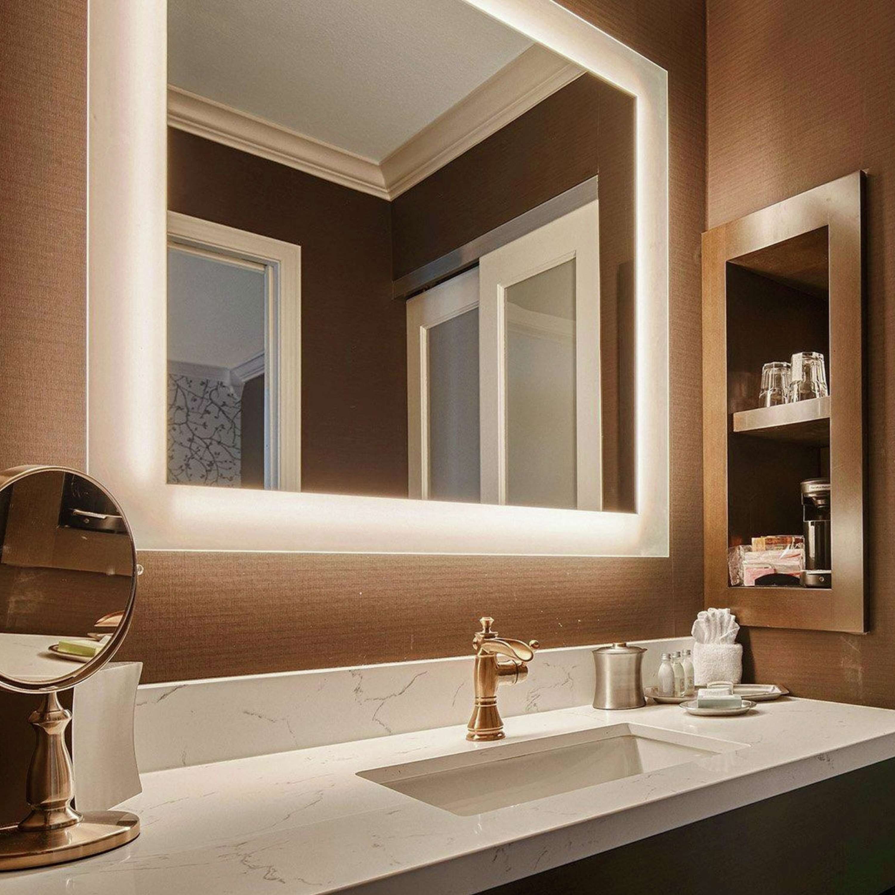 designer toiletries, hair dryer, towels