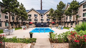 Seasonal outdoor pool, open 9:00 AM to 9:00 PM, pool umbrellas