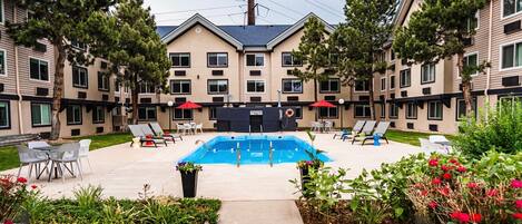 Seasonal outdoor pool, open 9:00 AM to 9:00 PM, pool umbrellas