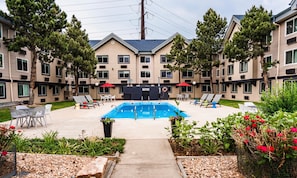 Seasonal outdoor pool, open 9:00 AM to 9:00 PM, pool umbrellas