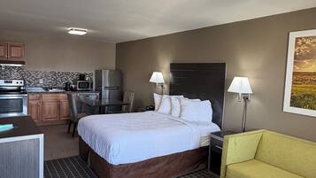 Standard Room, Multiple Beds, Non Smoking | Living area | 50-inch TV with cable channels