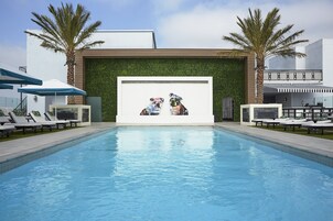 Outdoor pool, open 7:00 AM to 10 PM, cabanas (surcharge), pool umbrellas