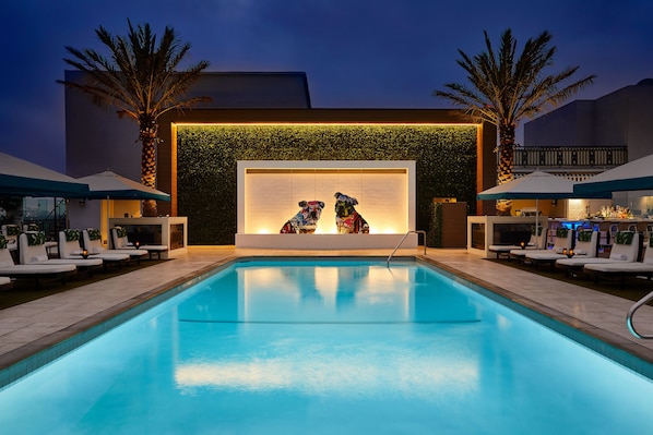 Outdoor pool, open 7:00 AM to 10 PM, pool cabanas (surcharge)