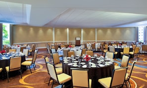 A conference room with round tables, chairs, and a podium. - Doubletree by Hilton Washington DC Silver Spring (Silver Spring)