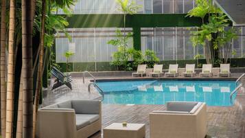 Outdoor pool, open 7:00 AM to 9:00 PM, sun loungers