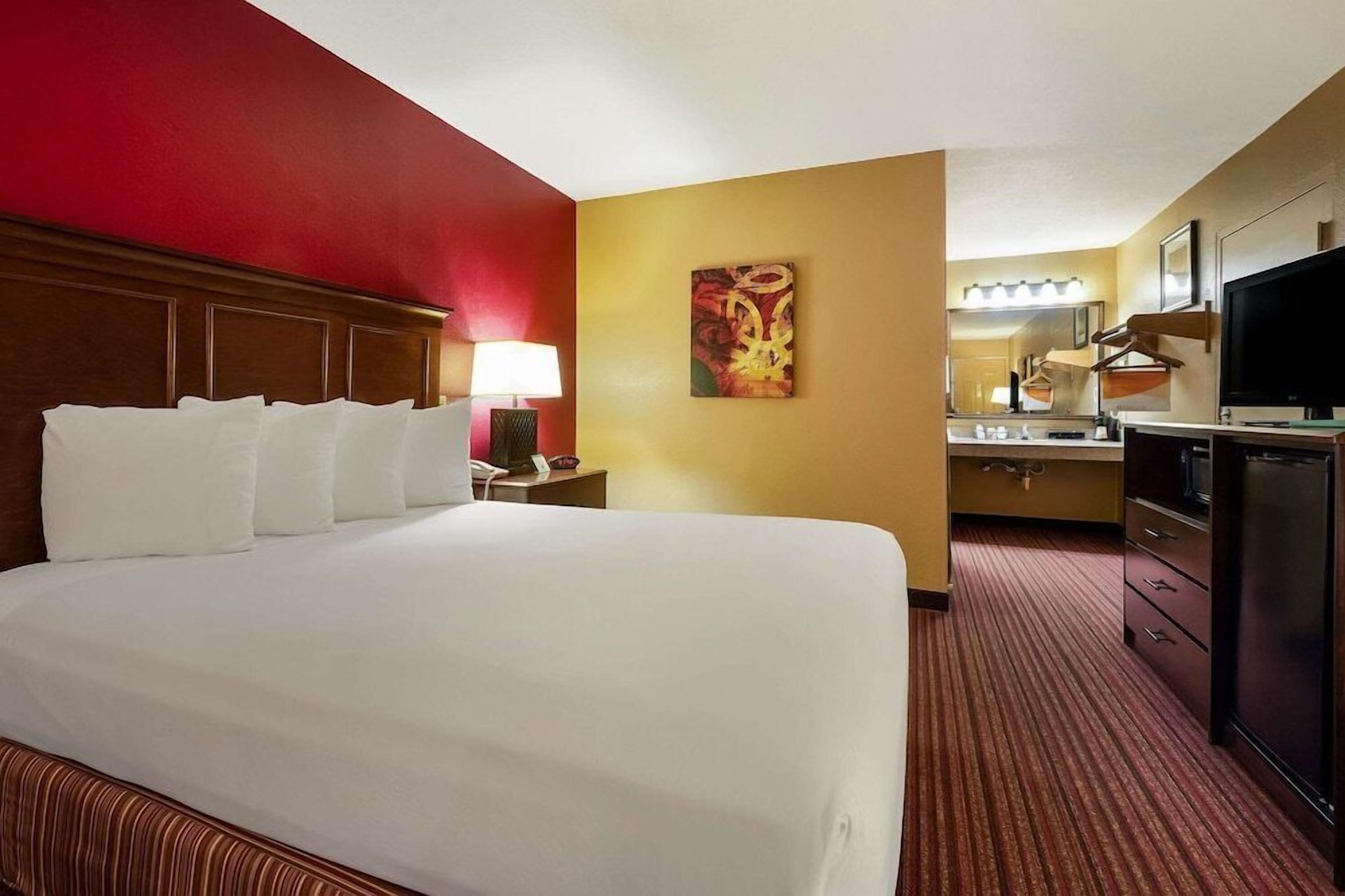 Premium bedding, blackout drapes, iron/ironing board, bed sheets