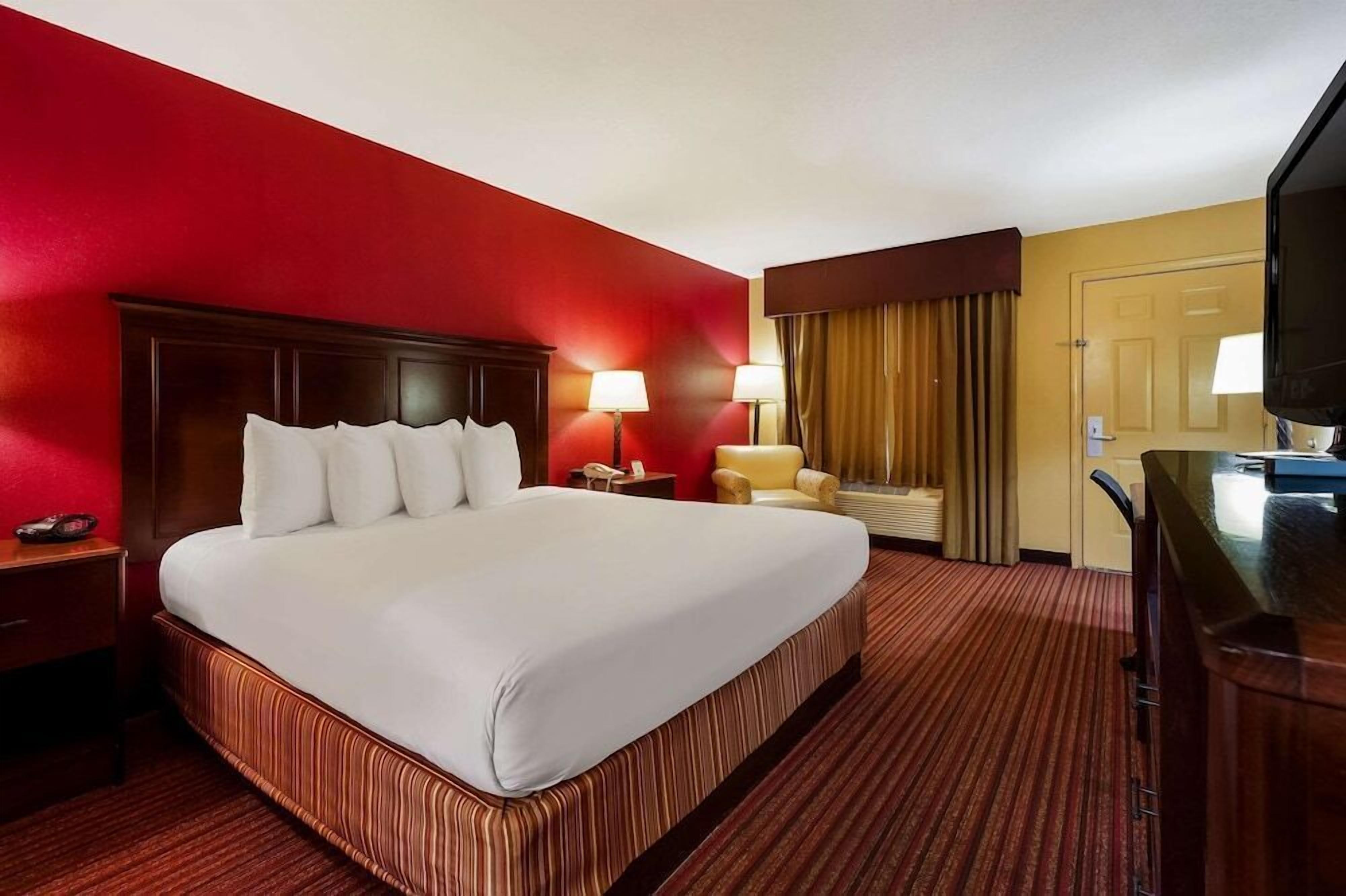 Premium bedding, blackout drapes, iron/ironing board, bed sheets