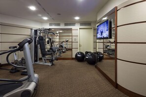 A gym with cardio machines, weight stations, and exercise balls. - UNA Hotels Cusani Milano (Milan)