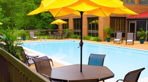 Seasonal outdoor pool, open 10:00 AM to 10:00 PM, pool umbrellas