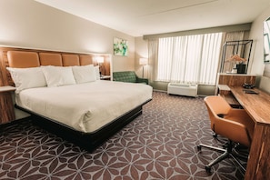 Premium bedding, desk, laptop workspace, blackout curtains