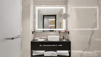 Un baño moderno con pared de mármol, un lavabo redondo, un espejo grande y un perchero para toallas.