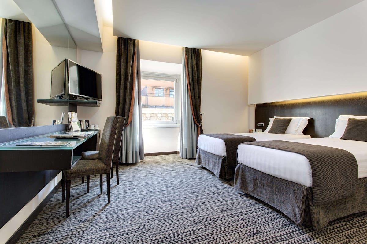 Premium bedding, memory-foam beds, minibar, in-room safe