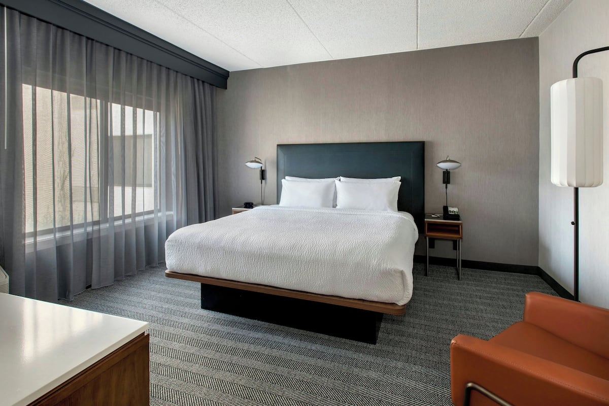 Premium bedding, desk, laptop workspace, iron/ironing board