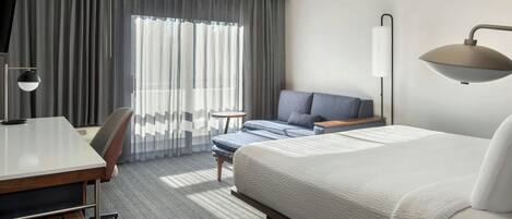 Premium bedding, desk, laptop workspace, iron/ironing board