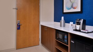 A kitchenette with a microwave, coffee maker, and a refrigerator. - Holiday Inn Express Walnut Creek by IHG (Walnut Creek)