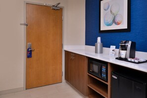 A kitchenette with a microwave, coffee maker, and a refrigerator. - Holiday Inn Express Walnut Creek by IHG (Walnut Creek)
