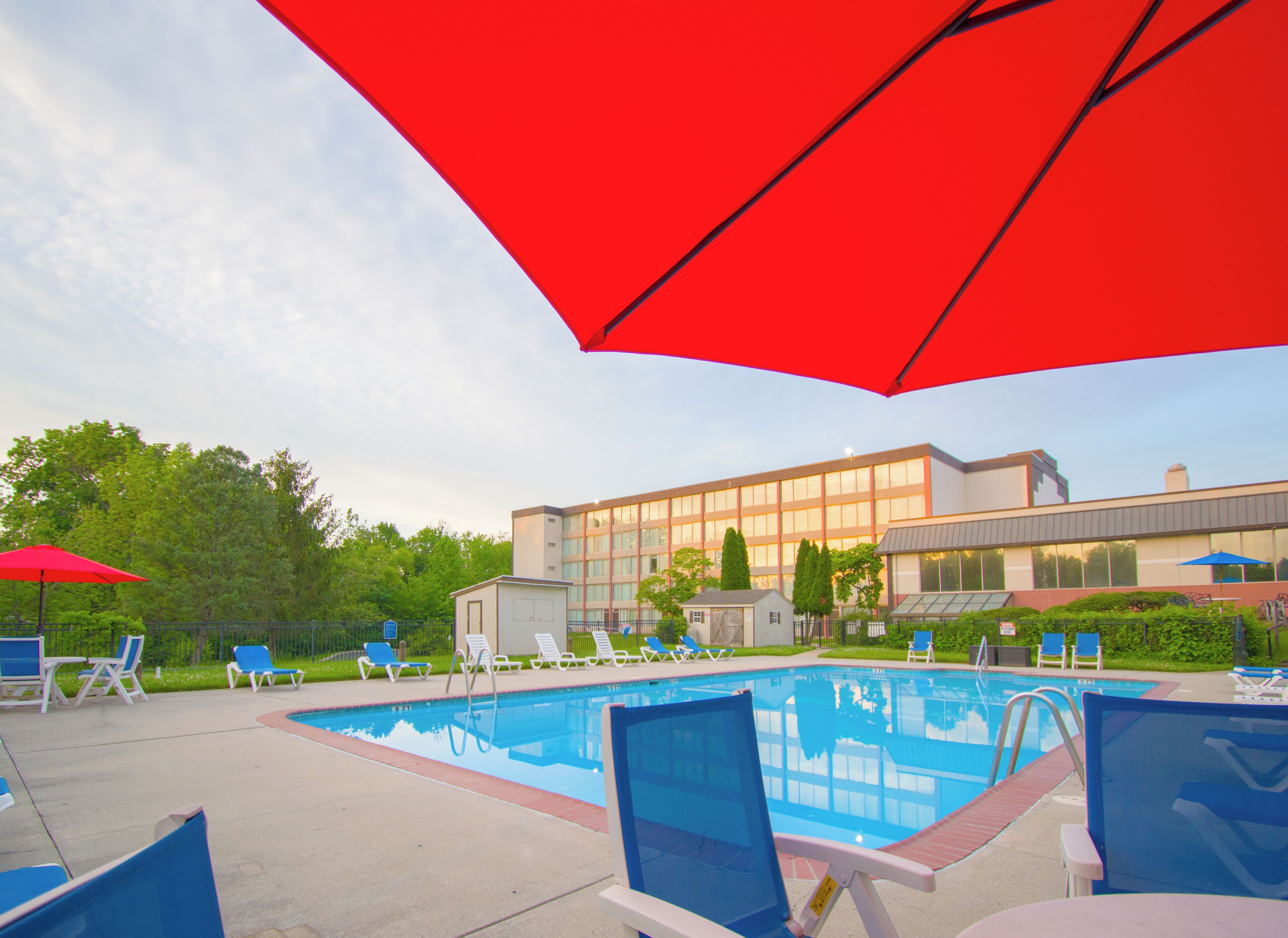 Seasonal outdoor pool, open 9 AM to 9:00 PM, pool umbrellas