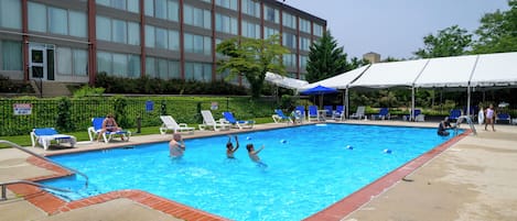 Seasonal outdoor pool, open 9 AM to 9:00 PM, pool umbrellas