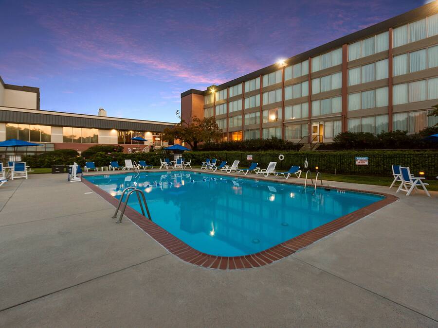 Seasonal outdoor pool, open 9 AM to 9:00 PM, pool umbrellas