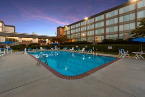 Seasonal outdoor pool, open 9 AM to 9:00 PM, pool umbrellas