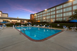 Seasonal outdoor pool, open 9 AM to 9:00 PM, pool umbrellas