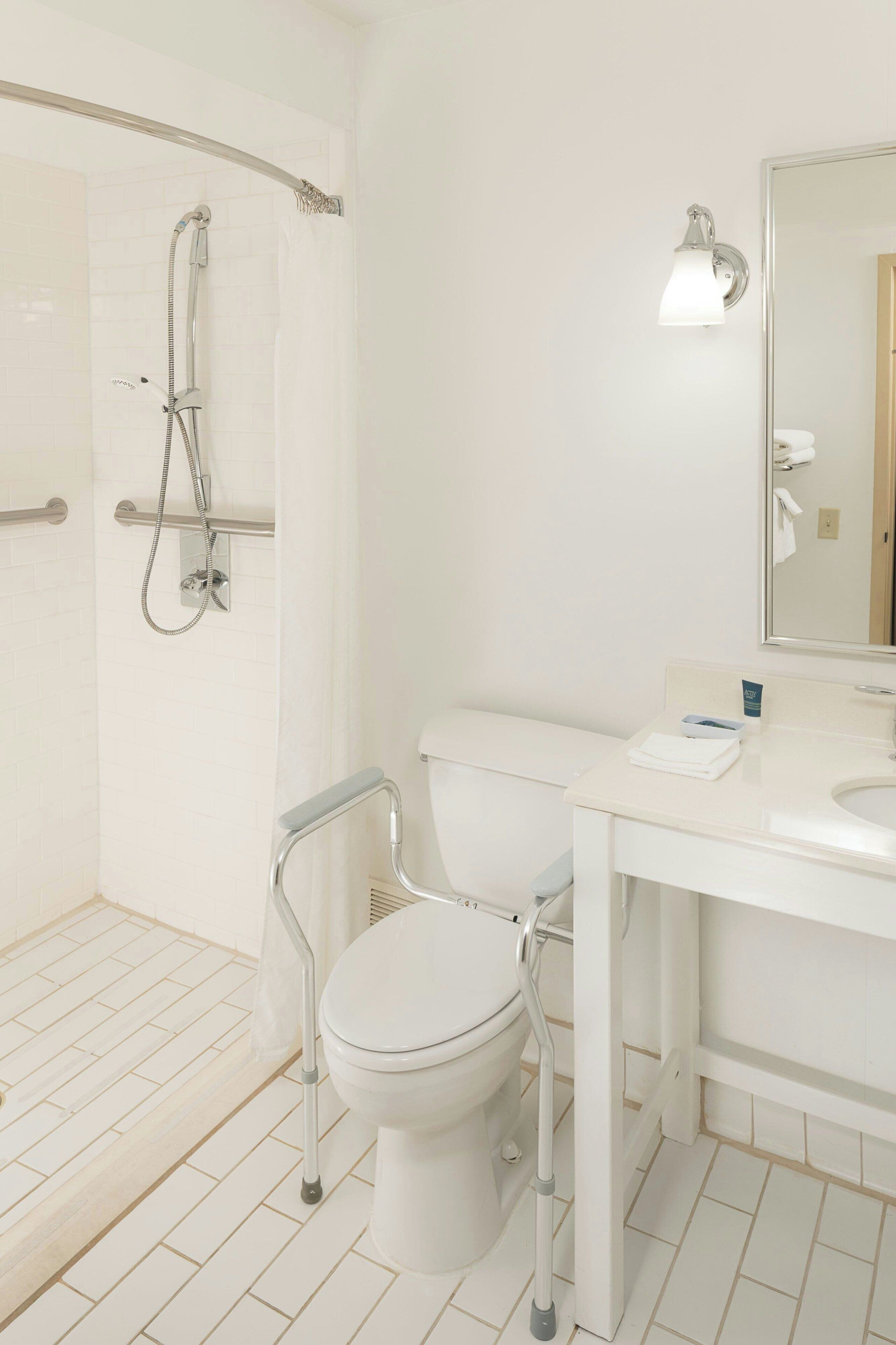 combined shower/bathtub, designer toiletries, hair dryer, towels