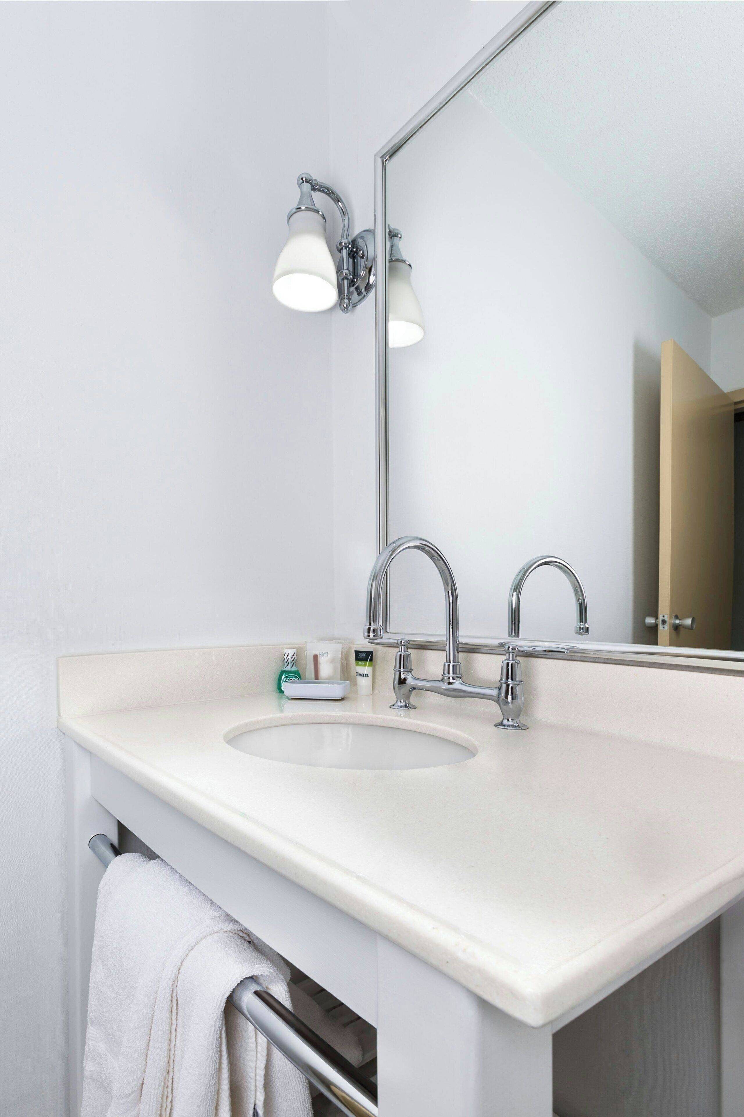 combined shower/bathtub, designer toiletries, hair dryer, towels