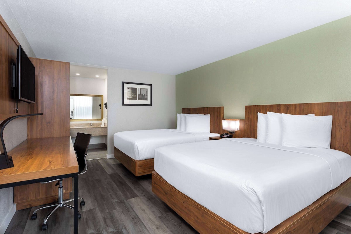 Room, 2 Queen Beds, Non Smoking | Desk, laptop workspace, blackout drapes, iron/ironing board