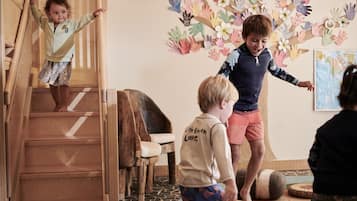 Children can play and climb on the wooden staircase in this lively play area.
