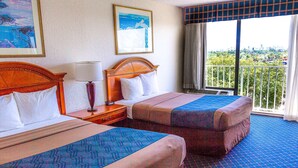 A hotel room with two beds, a nightstand, a lamp, and a window with a city view.