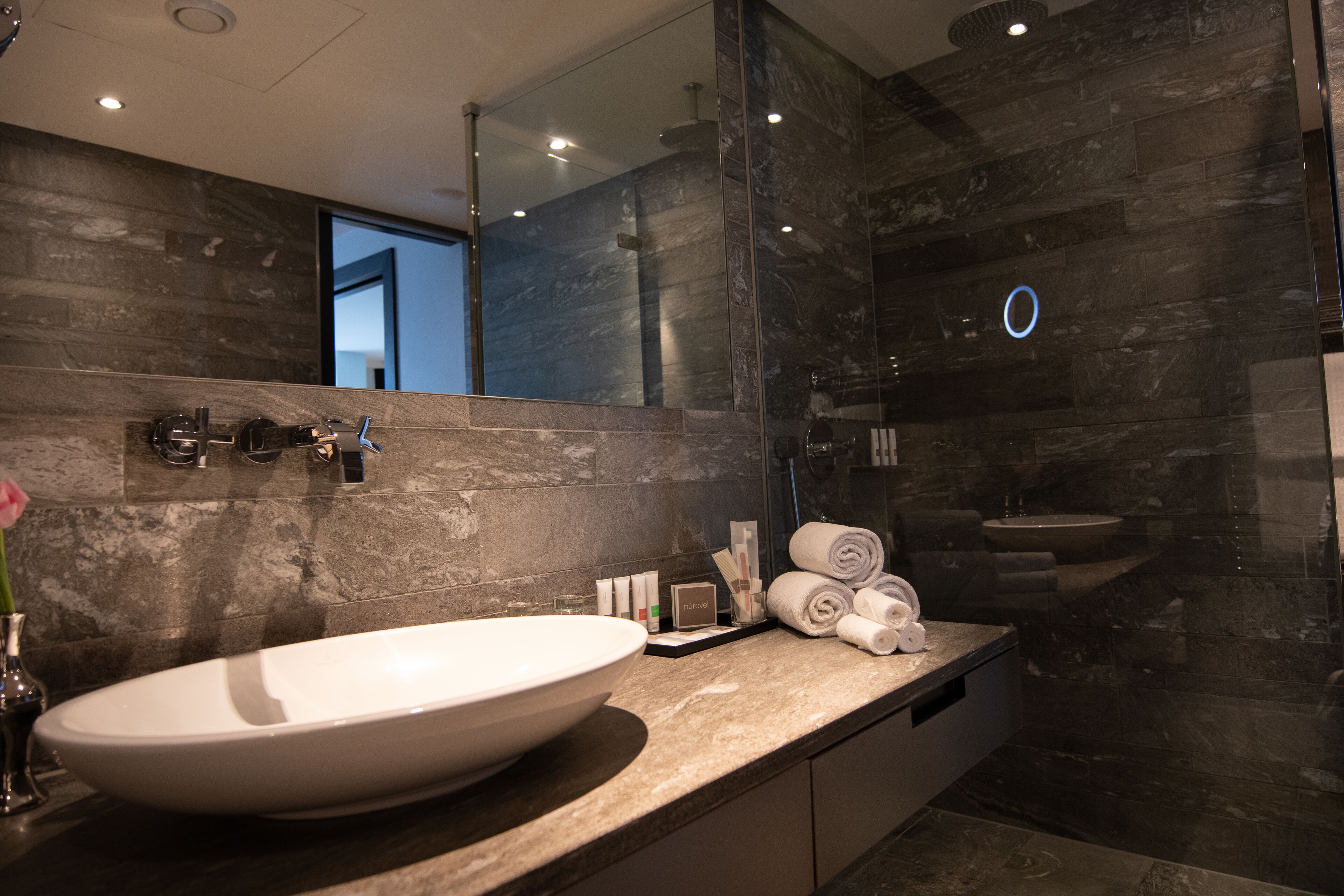 suite, 1 king bed, city view | bathroom | designer toiletries, hair dryer, slippers, towels
