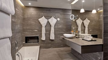 Designer toiletries, hair dryer, slippers, towels