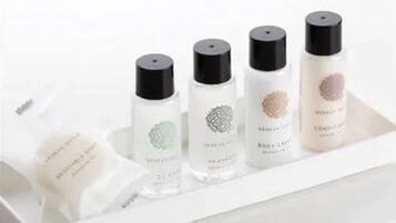 A set of skincare products arranged on a white tray.