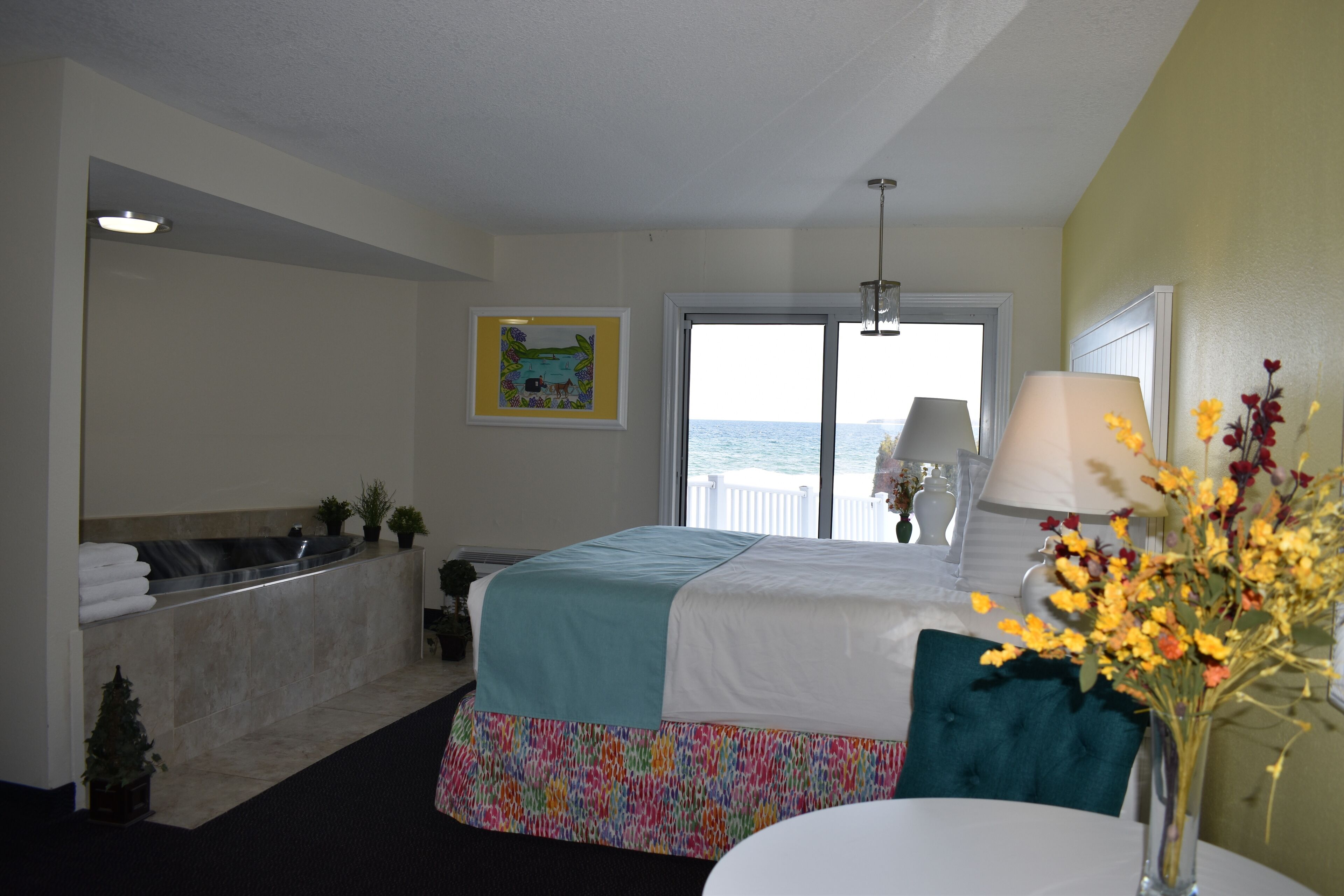 deluxe room, 1 king bed, partial lake view | blackout curtains, iron/ironing board, free wifi, bed sheets