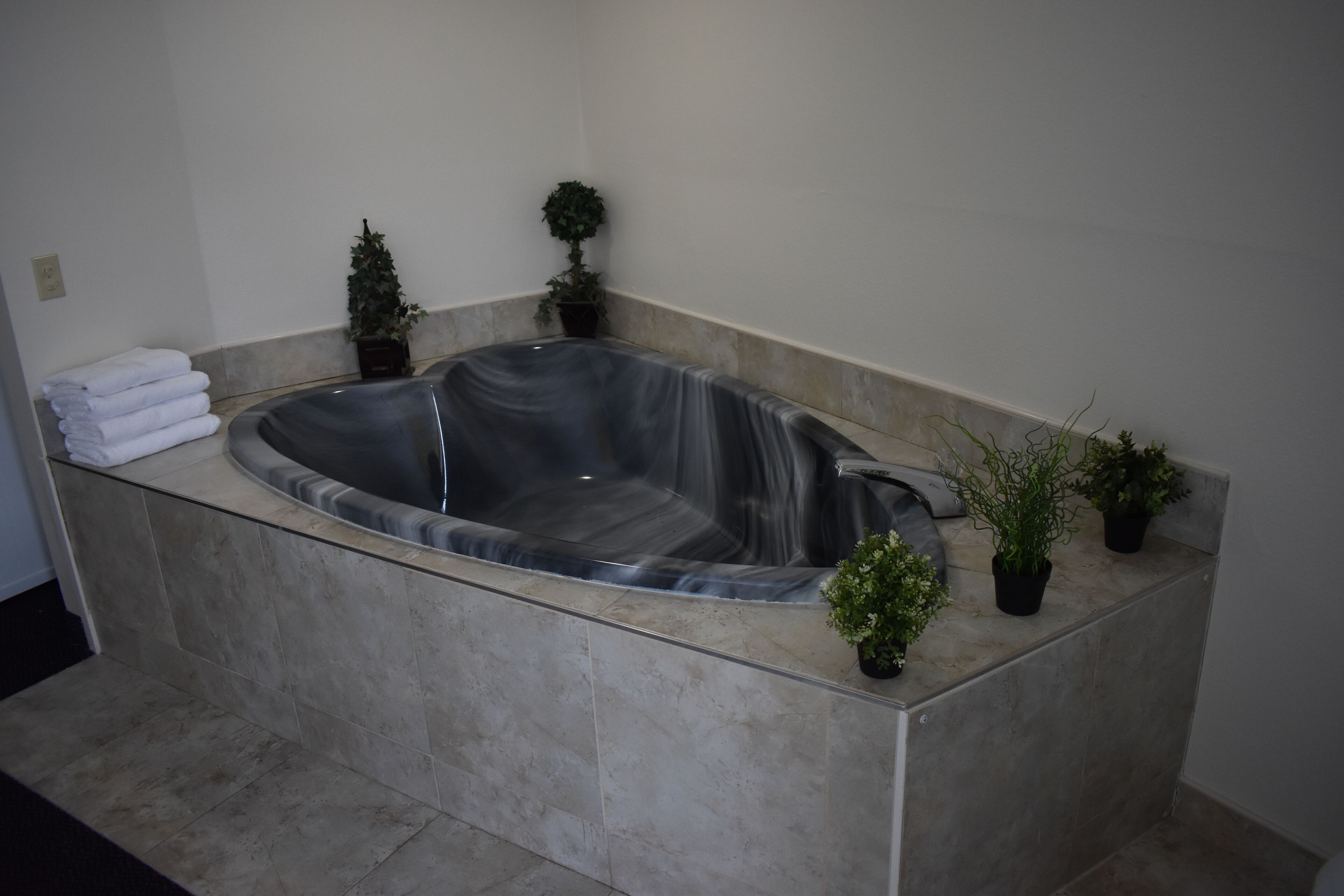 deluxe room, 1 king bed, partial lake view | blackout curtains, iron/ironing board, free wifi, bed sheets