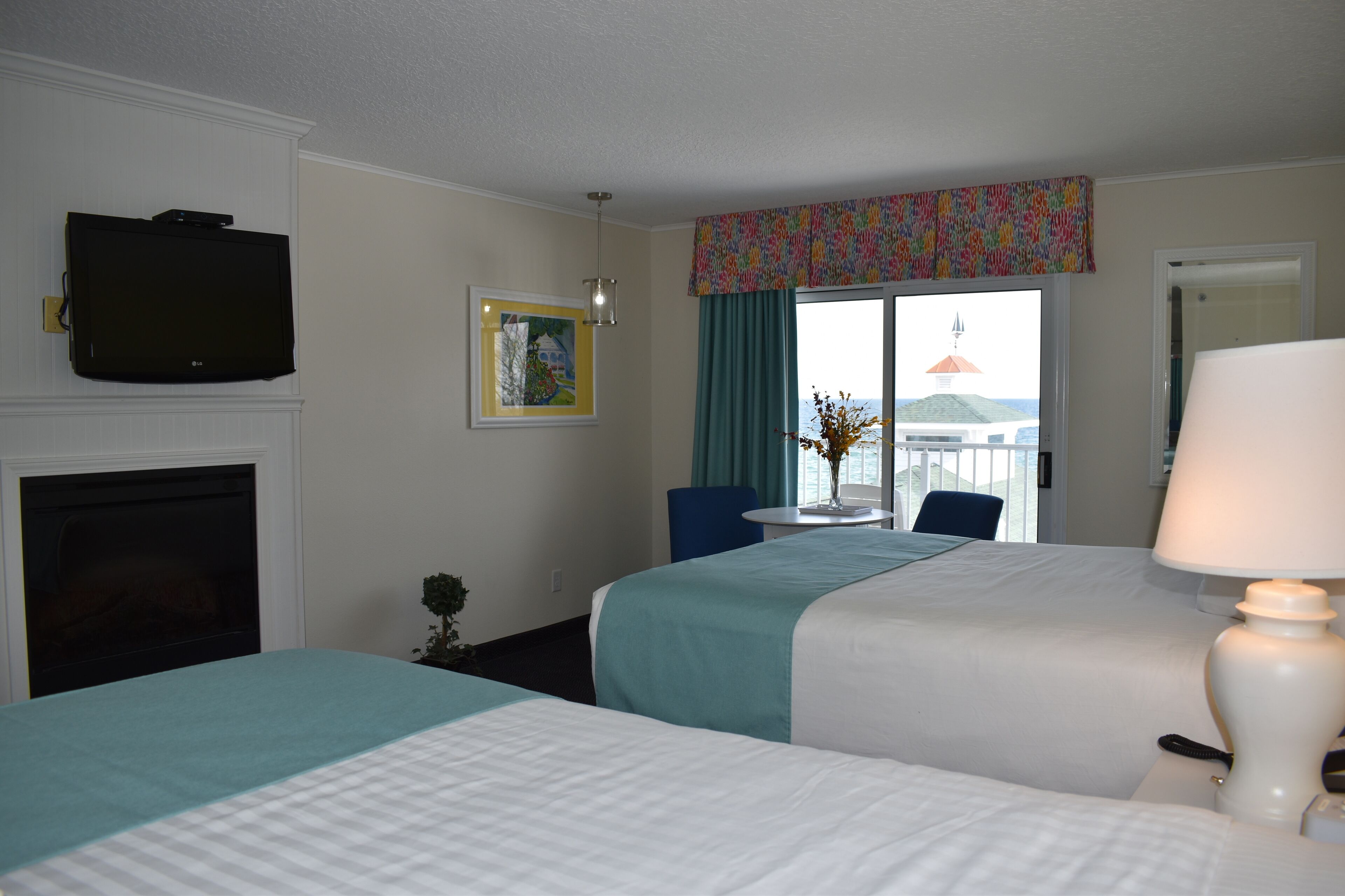 standard room, 2 queen beds, fireplace, partial lake view | blackout curtains, iron/ironing board, free wifi, bed sheets