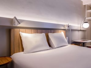 Premium bedding, desk, laptop workspace, blackout curtains