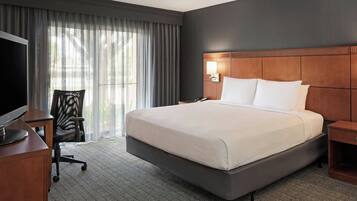 Desk, laptop workspace, blackout drapes, iron/ironing board