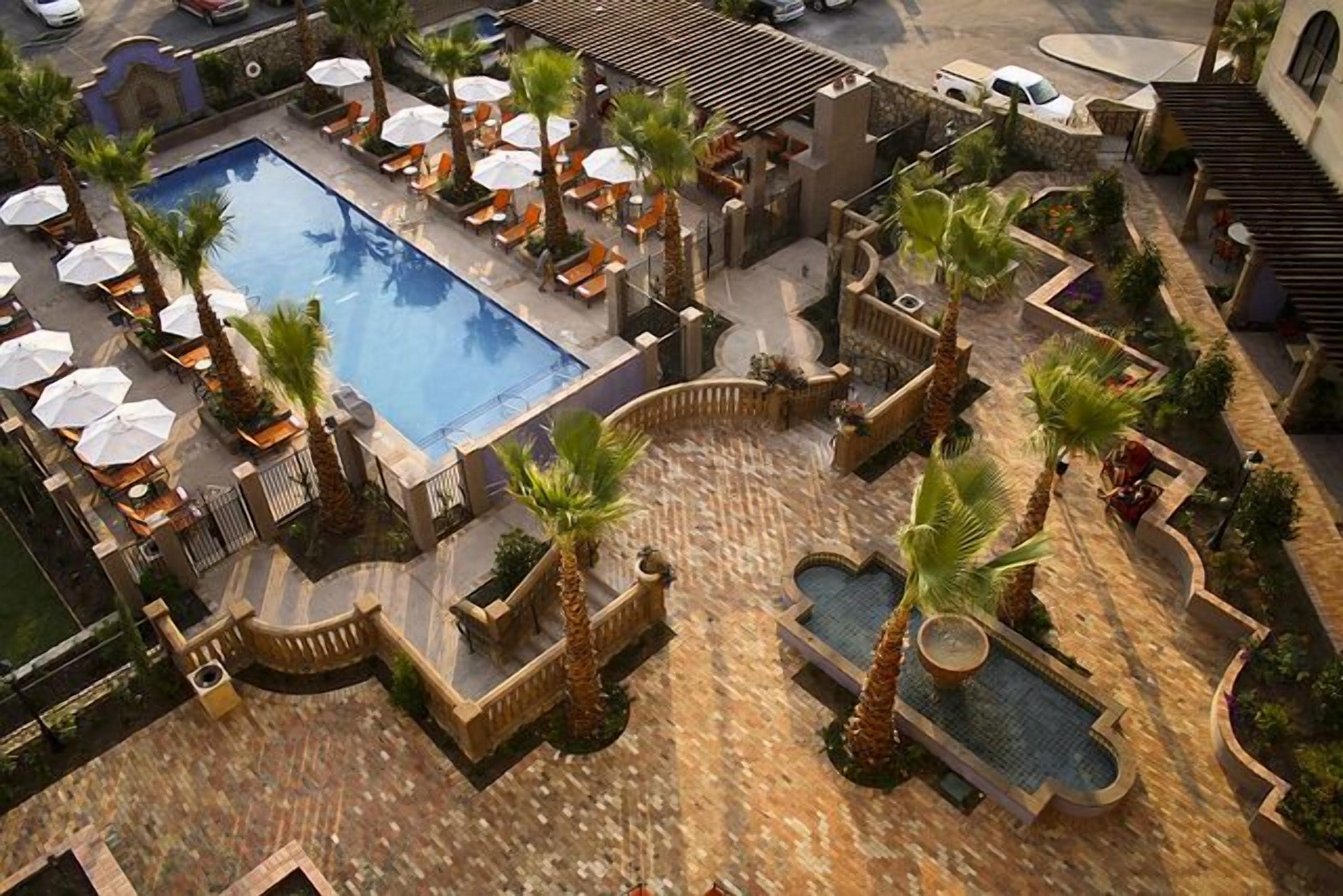 outdoor pool, open 8:00 am to 10:00 pm, pool umbrellas, pool loungers